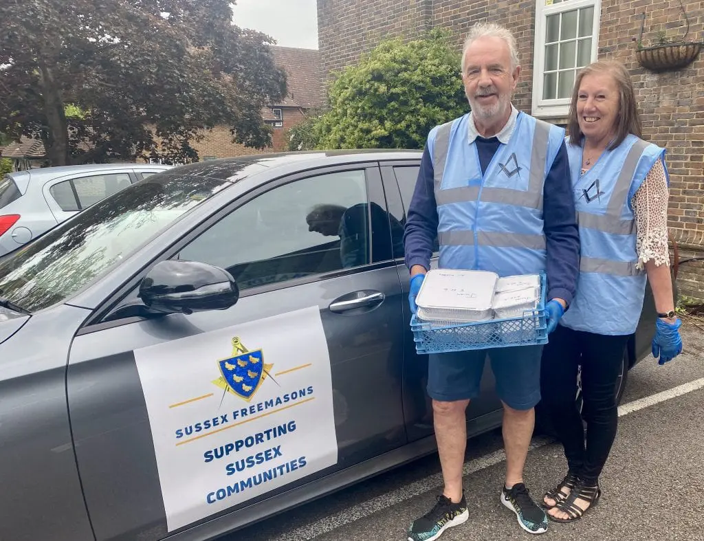 Food Donation. Graham & Jan Watkins - Horsham Freemasons with a hot food delivery