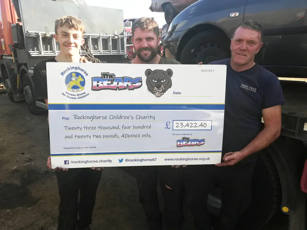 Leo, Ashley and Nigel Riley with cheque for Rockinghorse