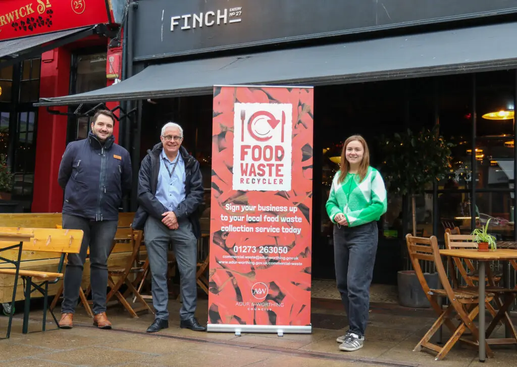 Cllr Edward Crouch, Paul Pitcon and Megan Dooley outside Finch Bar & Eatery as part of the food waste service