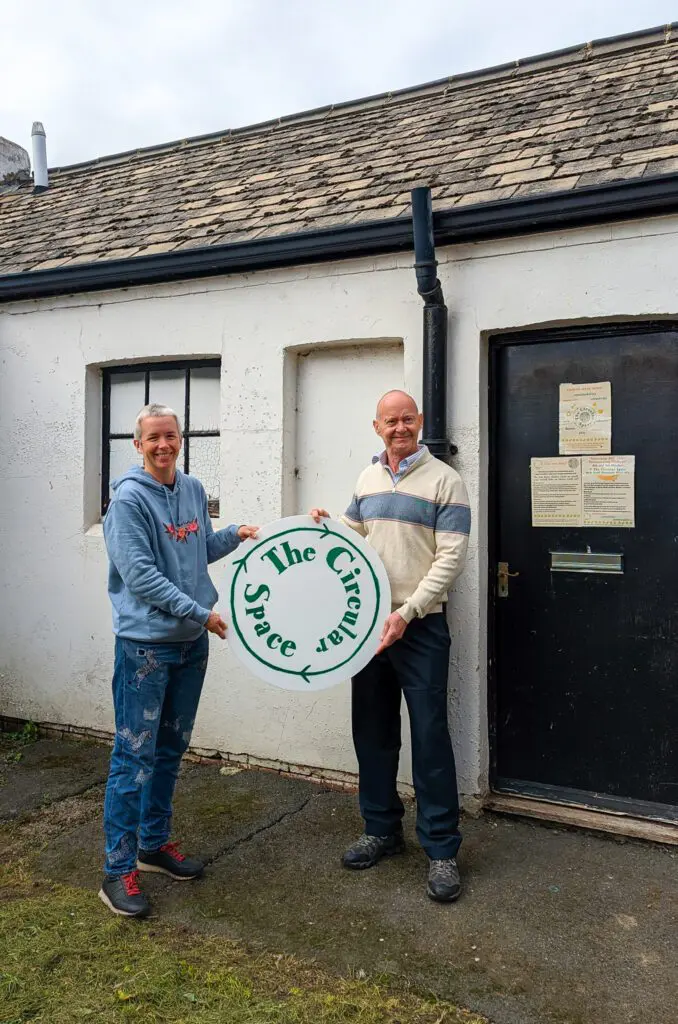 Emily Phillips from Over The Moon pictured with Cllr Kevin Boram outside their new premises in Shoreham