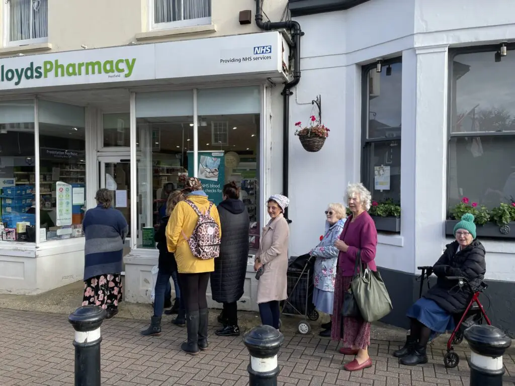 queue outside Lloyds Pharmacy in Henfield queue on 11 Nov