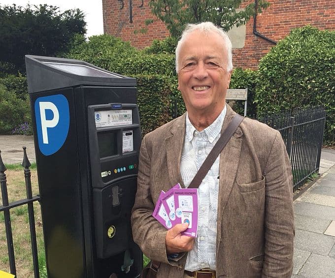 Chichester BID chairman Colin Hicks with on-street parking vouchers