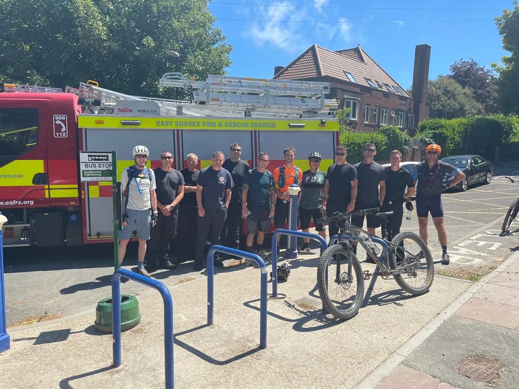 Crossing the finish line in Eastbourne with a welcome from the firefighter crew there