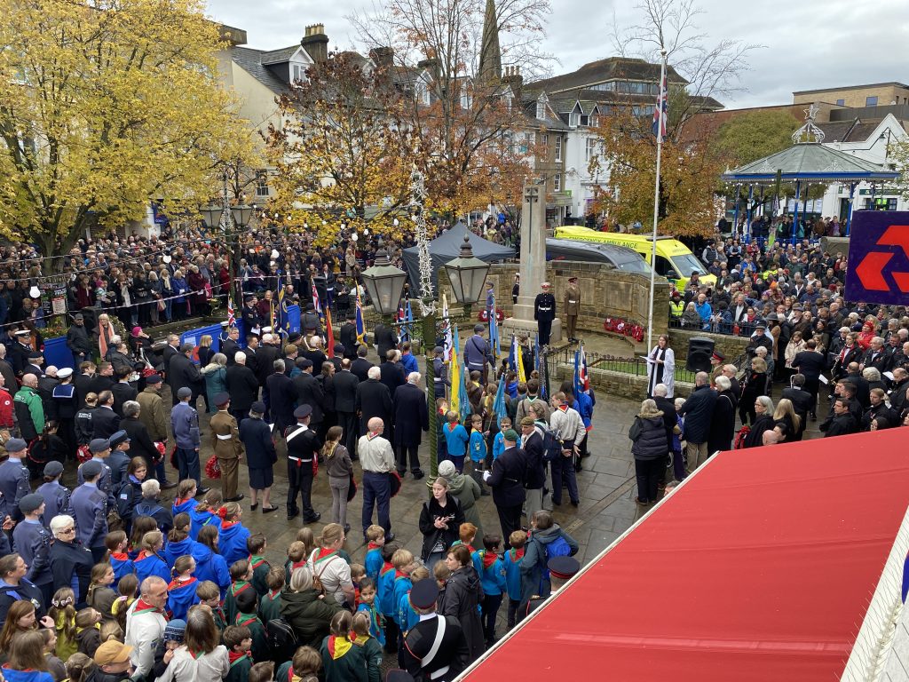 Remembrance Parade and crowds in Horsham's Carfax